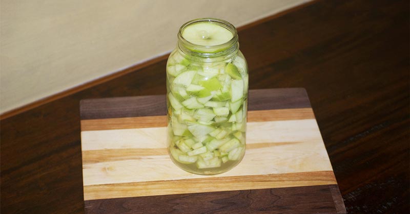 Jar full of fermented apples